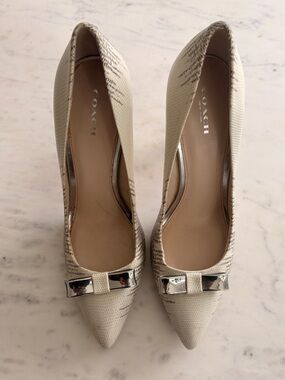 COACH Ivory Pointed Toe Pumps with Metallic Bow Accent
